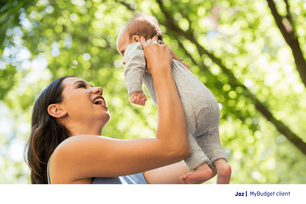 MyBudget client Jaz holds her newborn, embracing parenting with confidence. A well-planned budget helps her manage finances and provide for her baby stress-free.