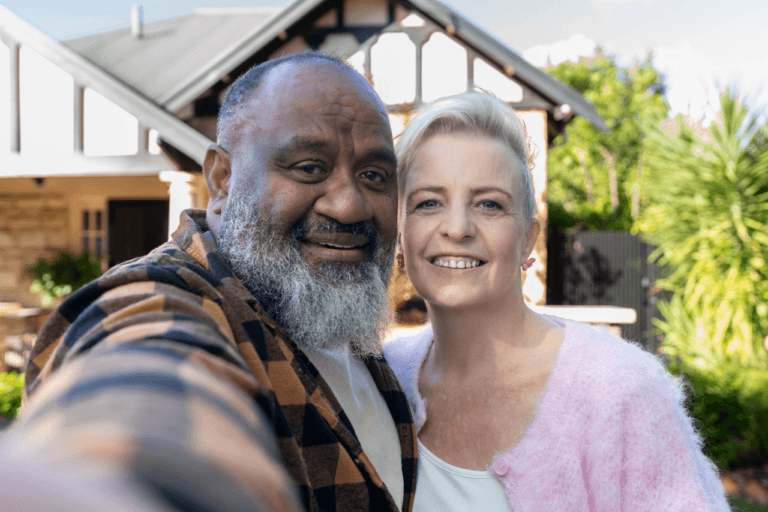 MyBudget clients Kim and Bob smiling together after achieving greater financial confidence.