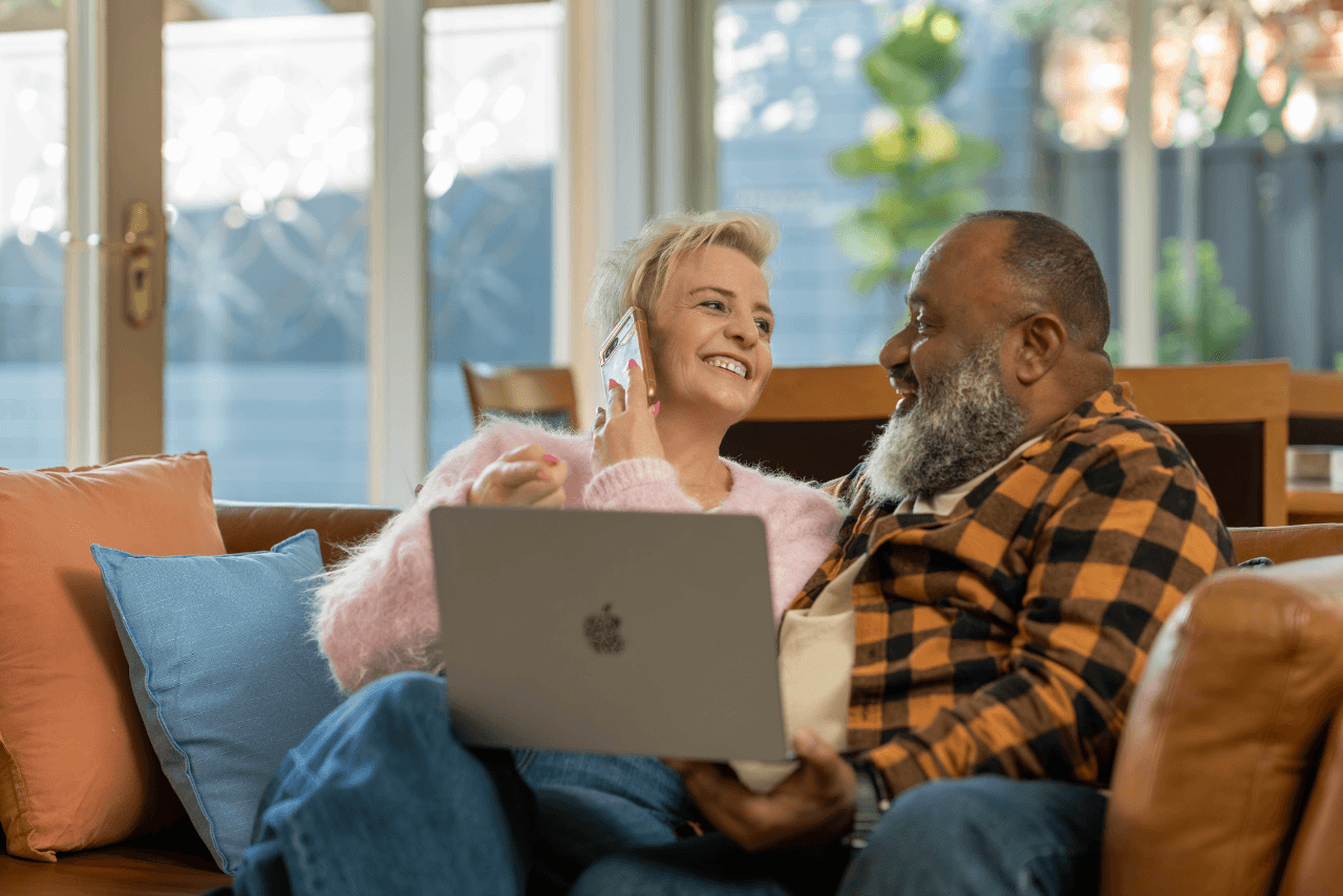 Kim and Bob reviewing their budget together with their MyBudget Money Coach in the comfort of their own home.