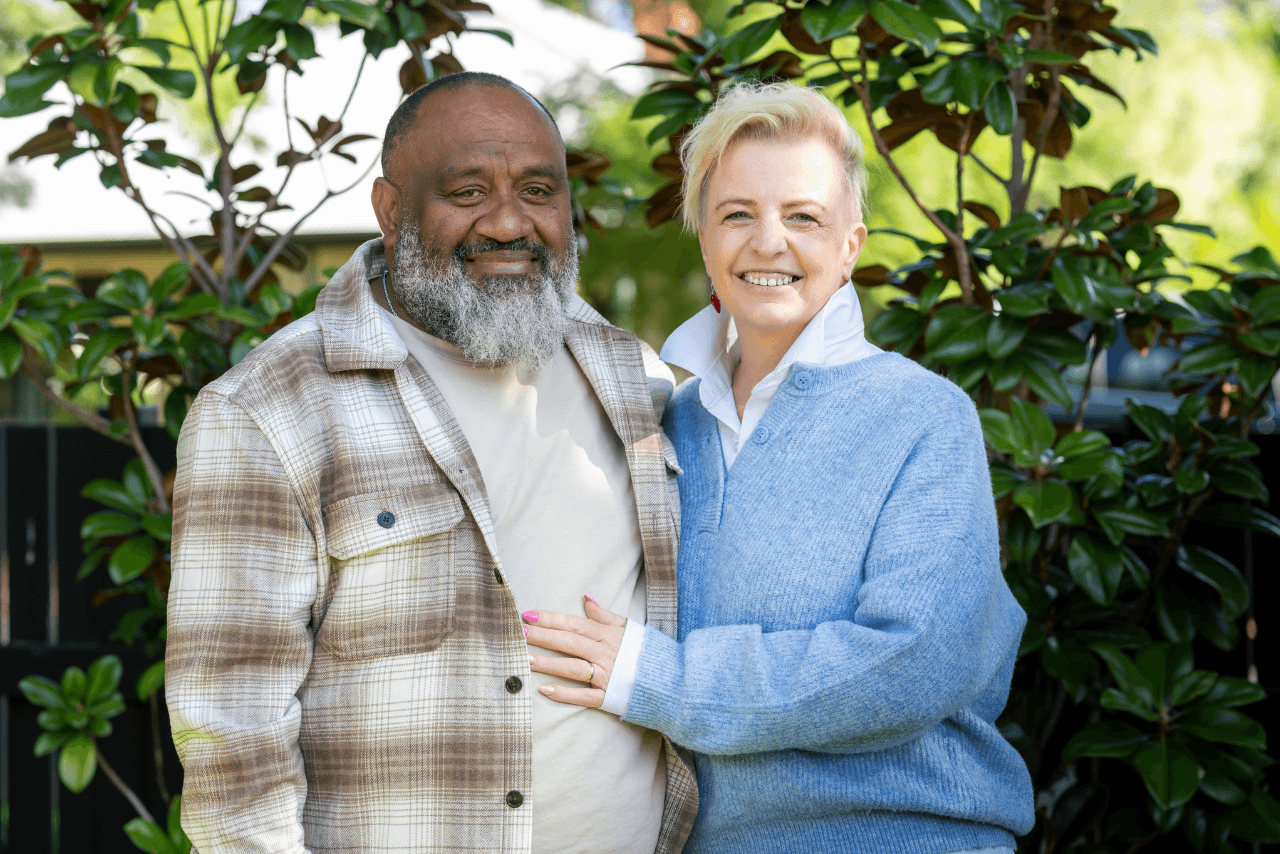 MyBudget clients Kim and Bob smiling together after achieving greater financial confidence.
